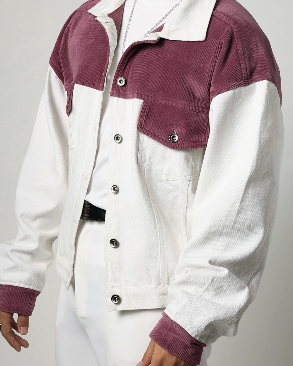 White jacket with onion pink accents on a plain background