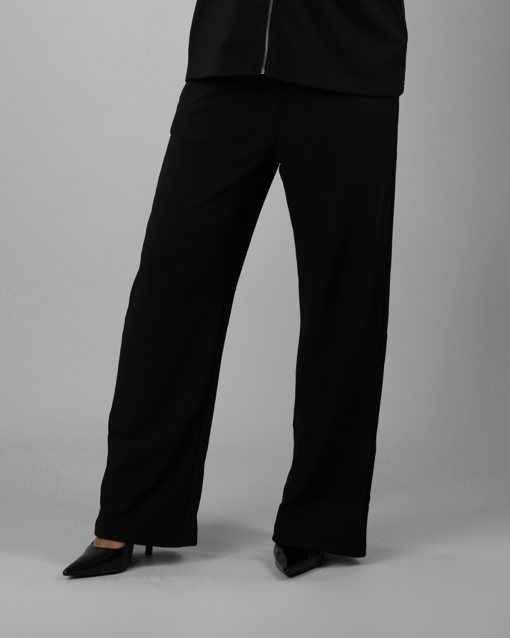 Black pants on a gray background